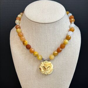 Agate and carnelian necklace with a carved floral pendant